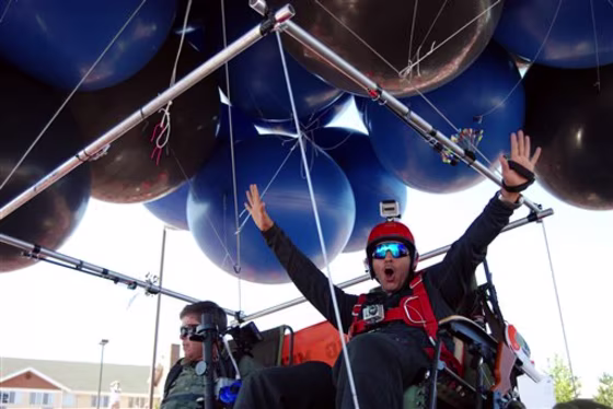 Iraqi adventurer Fareed Lafta, right, and Bend, Ore., gas station owner Kent Couch lift off Saturday from Couch's gas station in Bend, Ore., as they attempt to fly some 360 miles to Montana.